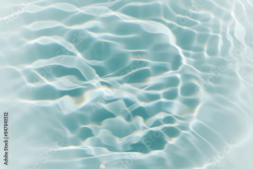 Blue water with ripples on the surface. Defocus blurred transparent blue colored clear calm water surface texture with splashes and bubbles. Water waves with shining pattern texture background.