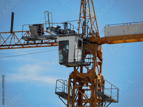 Wallpaper Mural Yellow construction tower crane against blue sky. Construction site. Architectural concept. Industry. Ust-Kamenogorsk (kazakhstan) Torontodigital.ca
