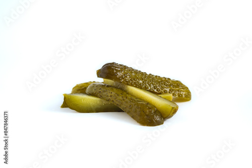 Принти на полотні pile of cucumber dill pickle cut into spears, isolated on white background