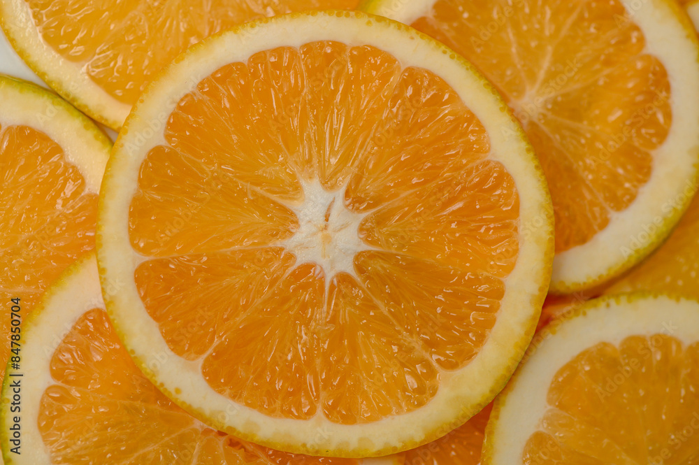 Sliced orange circles, laid on the surface in several layers. Tropical background for design and web 1 Sliced orange circles, laid on the surface in several layers. Tropical background for design and web 1