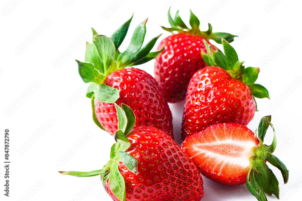 Strawberries isolated. Ripe sweet strawberries and half a berry on a white background. 1 Strawberries isolated. Ripe sweet strawberries and half a berry on a white background. 1