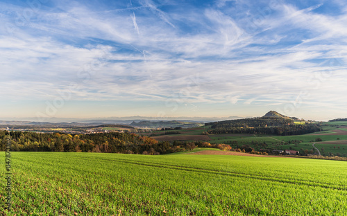 Hegau landscape, looking towards the town of Engen, on the right the Hohenhewen, on the horizon the Swiss Alps with Saentis and Churfirsten, Hegaublick, Hegau, Baden-Wuerttemberg, Germany photo