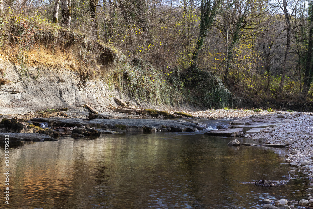 rocky river bottom in shallow water, rock fraction from rock,background for design solutions rocky river bottom in shallow water, rock fraction from rock,background for design solutions