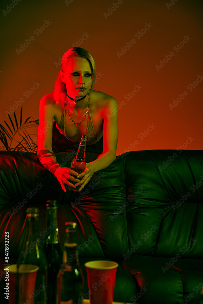 A woman relaxing on a couch in a room setting A woman relaxing on a couch in a room setting