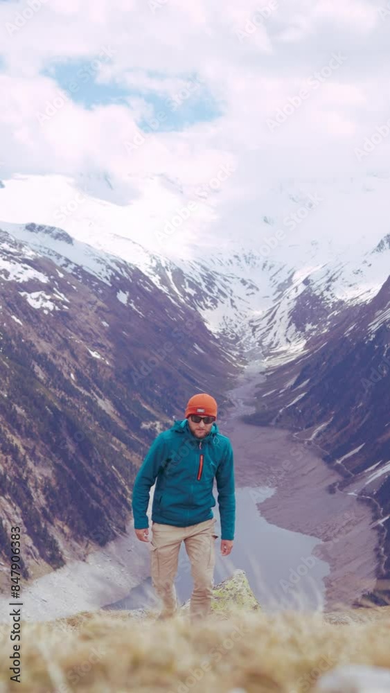 A man is hiking in the Austrian Alps. An extremely beautiful and epic landscape. A man is hiking in the Austrian Alps. An extremely beautiful and epic landscape.