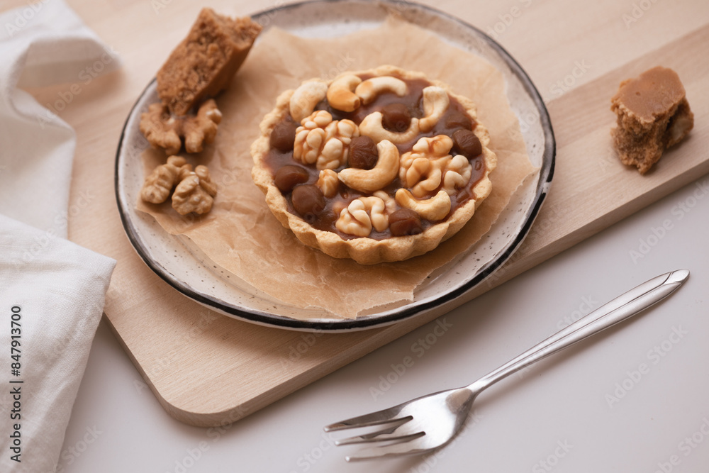 nut tart made from shortcrust pastry with walnuts, cashews and hazelnuts