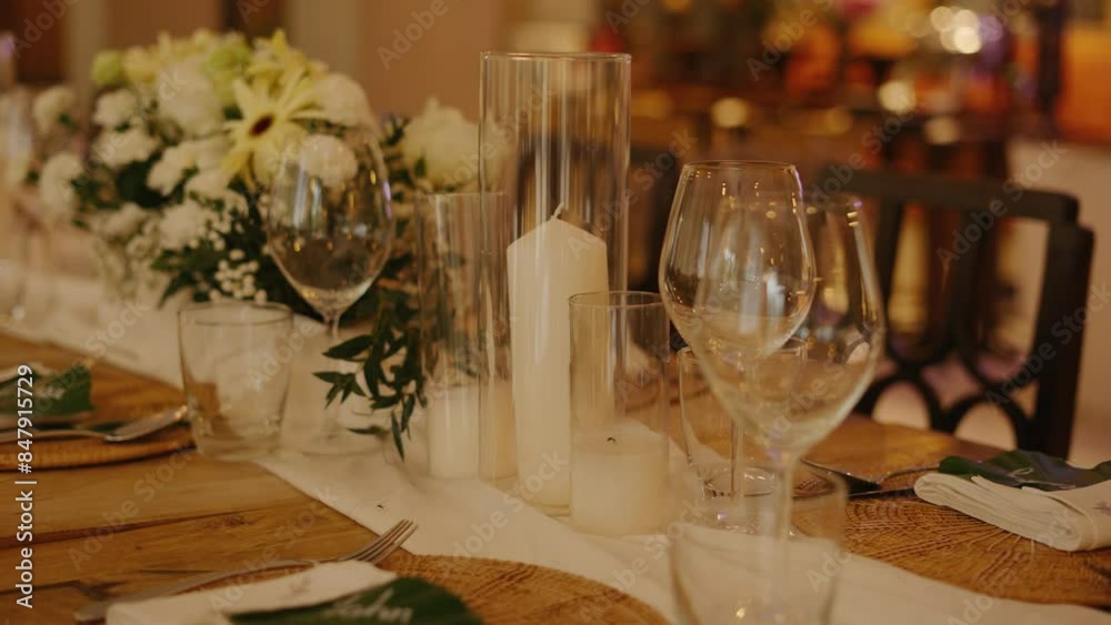 Wedding table rustic style decor with dishes, drinks and flowers Bulk candles made of granulated wax and decorative flowers in Provence style for celebrating a wedding reception Wedding table rustic style decor with dishes, drinks and flowers Bulk candles made of granulated wax and decorative flowers in Provence style for celebrating a wedding reception