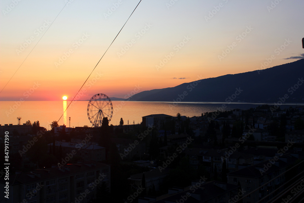 Obraz premium View of the city and the sea at sunset. Gagra, Abkhazia