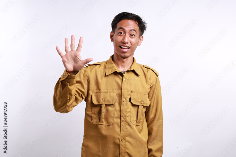 Happy Indonesian government employees standing while showing five fingers. Isolated on white Happy Indonesian government employees standing while showing five fingers. Isolated on white