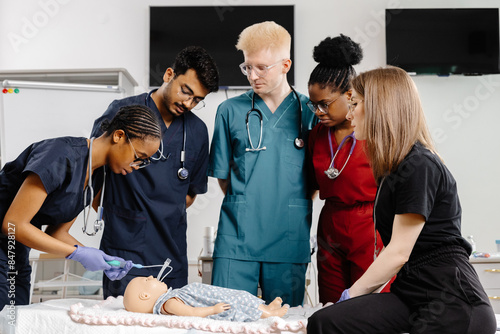 Tableau sur toile Medical Students Practicing Resuscitation on a Training Dummy