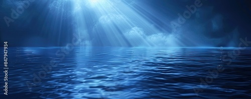 Serene landscape with light shining through water on dark blue background © Alexei