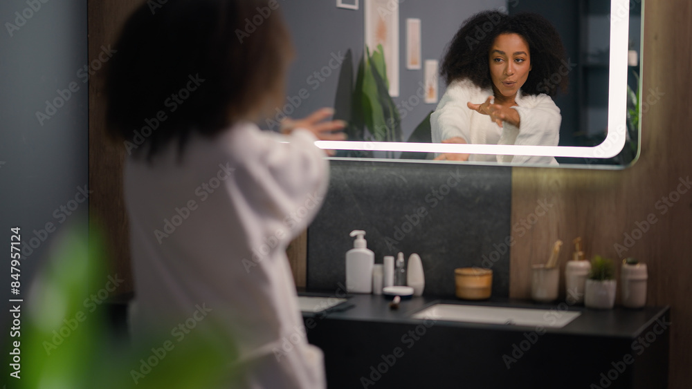 Morning fun fooling at home hotel bathroom happy attractive beautiful cheerful carefree girl sing funny dancing African American woman looking at mirror dance singing beauty procedure preparing joy Morning fun fooling at home hotel bathroom happy attractive beautiful cheerful carefree girl sing funny dancing African American woman looking at mirror dance singing beauty procedure preparing joy