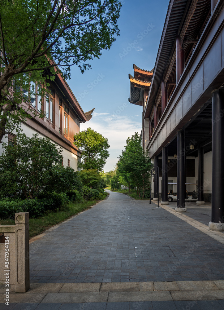 Serene Pathway Between Traditional Buildings Serene Pathway Between Traditional Buildings