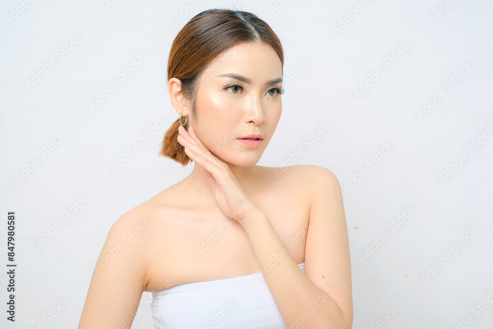 Charming Asian Woman in White Top Touching Her Beauty Face Charming Asian Woman in White Top Touching Her Beauty Face