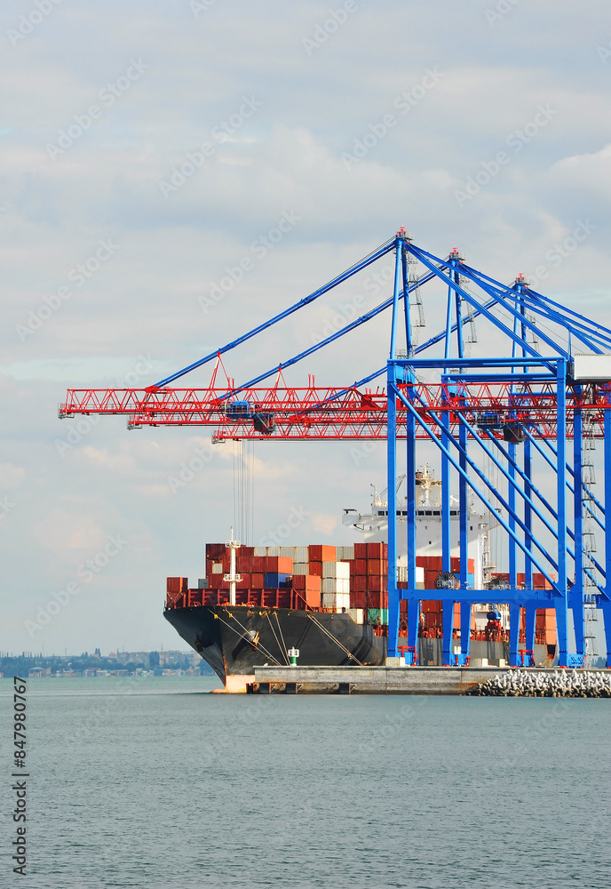 Container ship under port crane Container ship under port crane