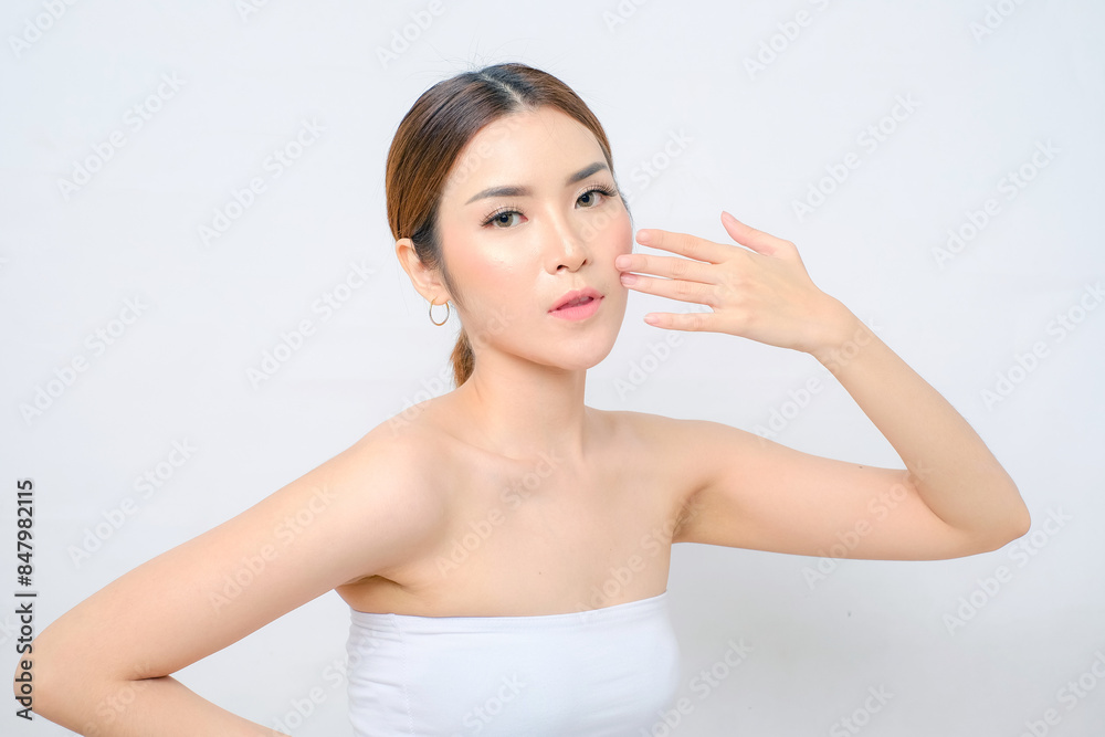 Elegant Asian Woman in White Top with Hands on Her Beauty Face Elegant Asian Woman in White Top with Hands on Her Beauty Face