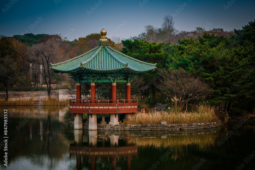 Sunset at the Hyangwonjeong Pavilion in the center of the pond in the Gyeongbokgung palace, Seoul, South Korea.