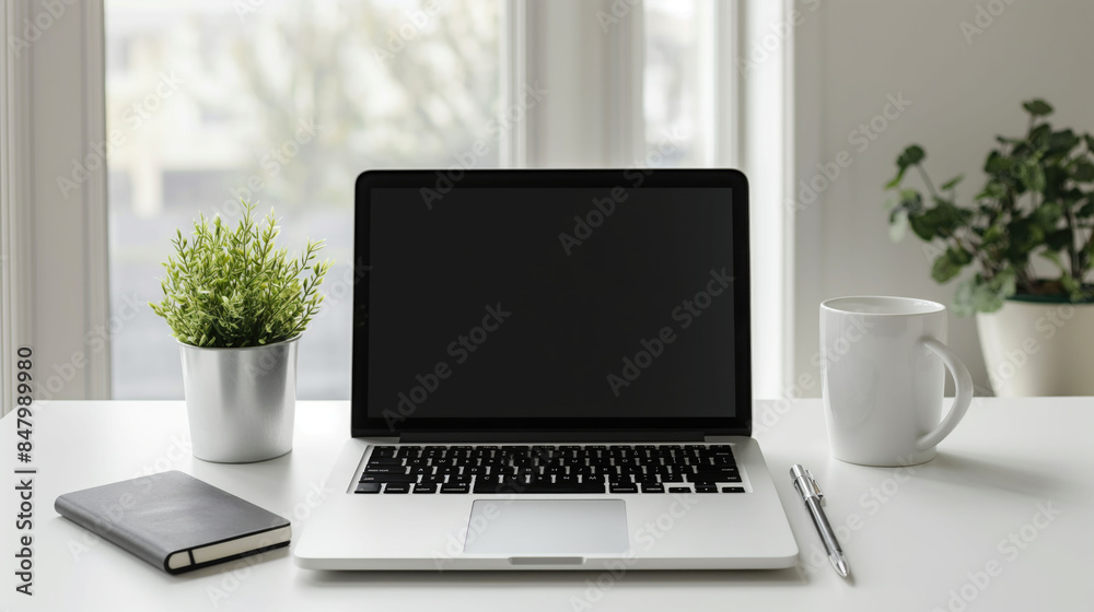 Laptop mockup with stationary tools on the home office white table with view to the window Laptop mockup with stationary tools on the home office white table with view to the window