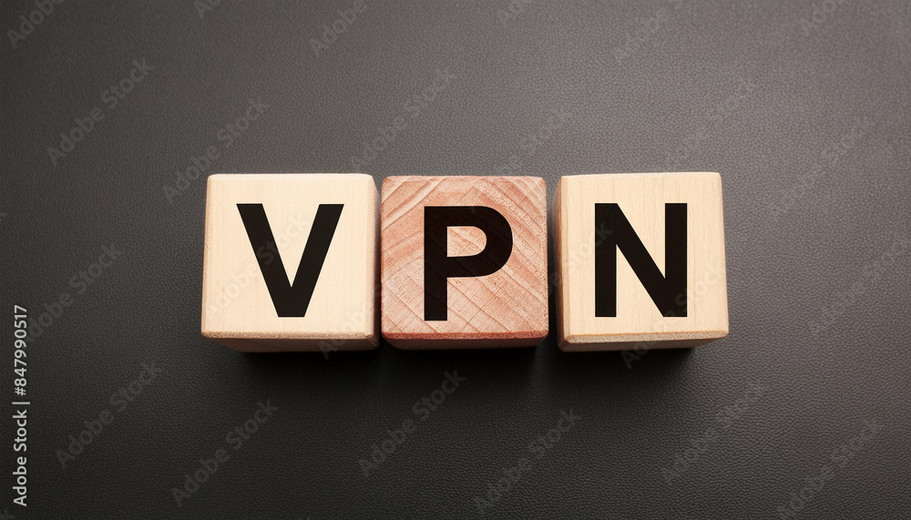 Obraz premium Wood blocks with abbreviation text VPN. Virtual private network. Secure connection. Top view, flat lay.