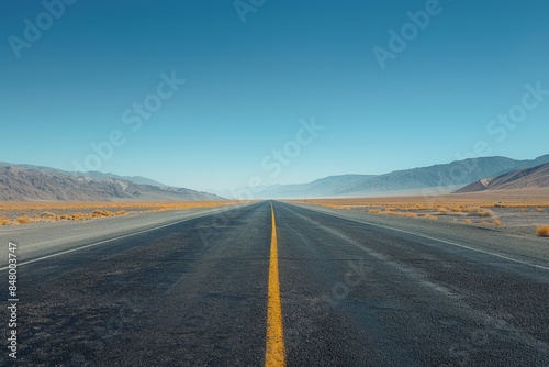 Mirage of a Distant Lake on Empty Desert Road - Surreal Documentary Landscape Photography for Editorial Content © taelefoto