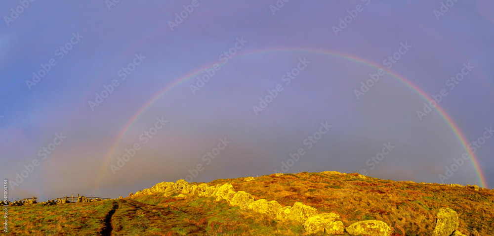 Rainbow in the rocky Lands End landscape, Cornwall,
