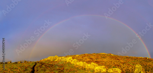 Obraz na płótnie Rainbow in the rocky Lands End landscape, Cornwall, w salonie