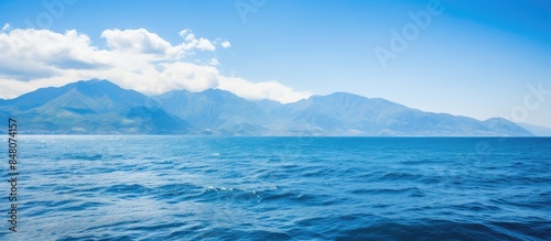 Panoramic views of the blue sky and mountains above the ocean. Creative banner. Copyspace image