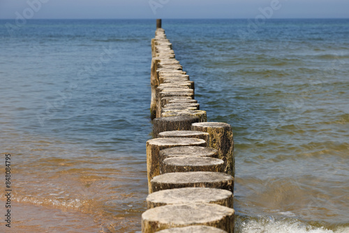 Fototapeta Naklejka Na Ścianę i Meble -  Coastal protection against sea waves by breakwaters driven into the seabed