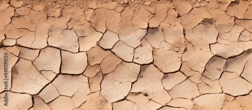 Closeup dry cracked earth background clay desert texture on rock. Creative banner. Copyspace image