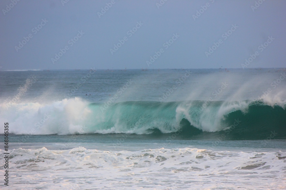 photo of waves rolling in the ocean photo of waves rolling in the ocean