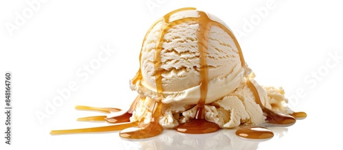 Vanilla ice cream topped with warm caramel sauce set against a white backdrop