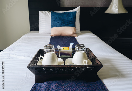 Hotel complimentary arranged on the bed in hotel bedroom.