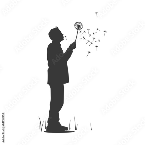Silhouette of a man blowing dandelion seeds, wish fulfillment concept.