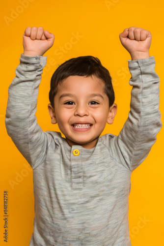 a Hispanic child feeling proud on a studio background