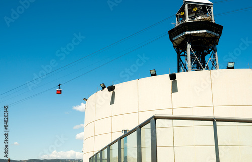 Red funicular cars against blue skies. 