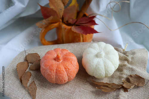 autumn time. handmade candles made of natural soy wax in the shape of a pumpkin photo