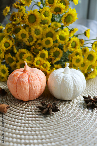 autumn time. handmade candles made of natural soy wax in the shape of a pumpkin photo