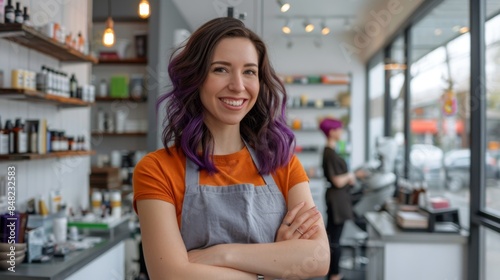 The smiling hairstylist in salon
