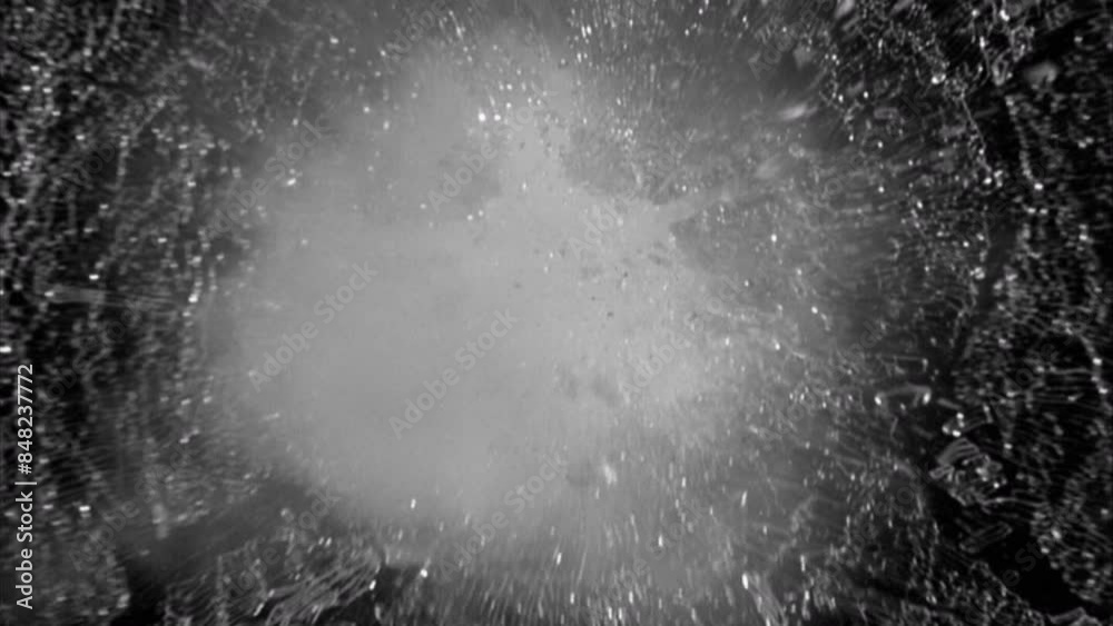 Breaking Glass.
This stock motion graphics video shows glass shattering.