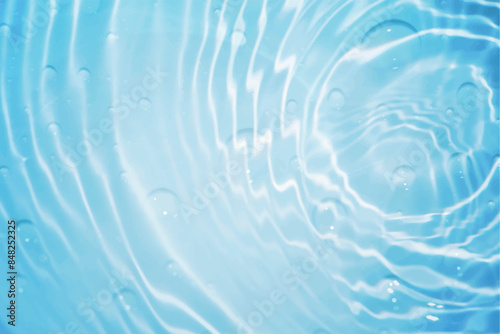 Blue water with ripples on the surface. Defocus blurred transparent blue colored clear calm water surface texture with splashes and bubbles. Water waves with shining pattern texture background.