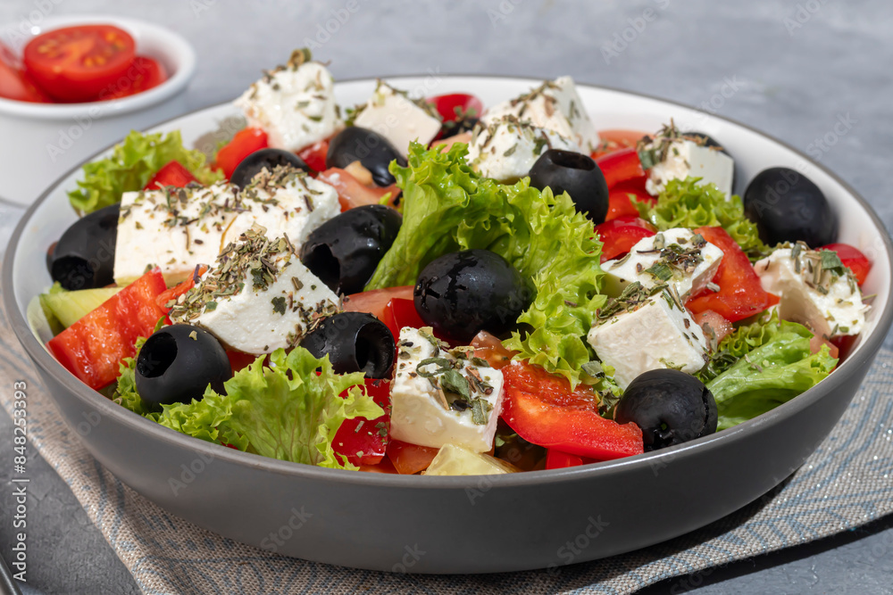 Salad with olives and cucumbers, tomatoes, cheese and sauce. Boiled egg. Salad with olives and cucumbers, tomatoes, cheese and sauce. Boiled egg.