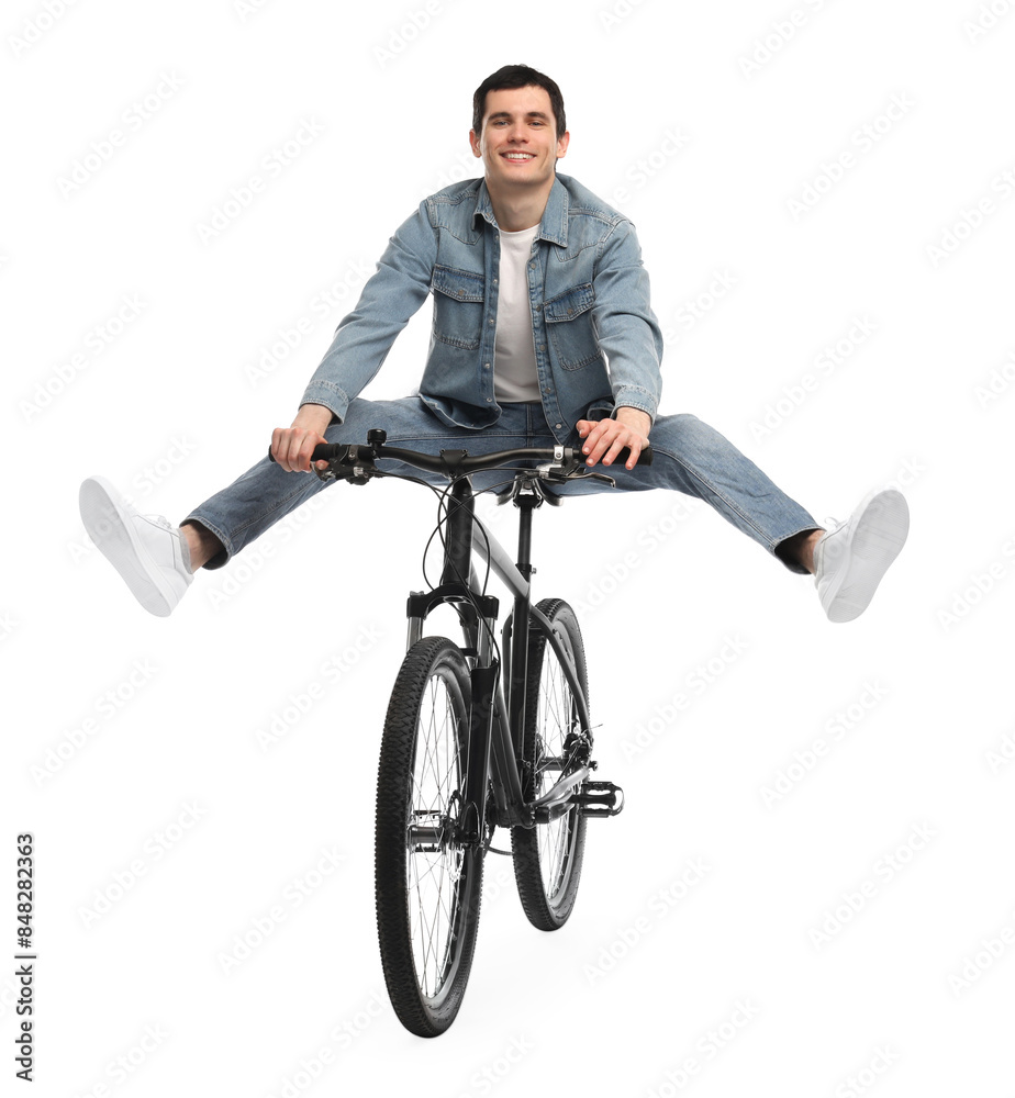 Smiling man having fun while riding bicycle on white background Smiling man having fun while riding bicycle on white background