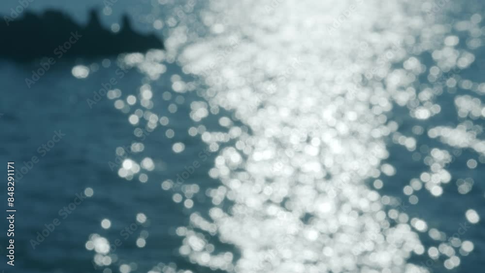 Glittering path of sunlight oт calm blue sea water bokeh. Looping video of beautiful vivid nature. Glittering path of sunlight oт calm blue sea water bokeh. Looping video of beautiful vivid nature.