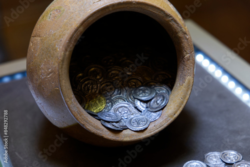 amphora full of ancient coins photo