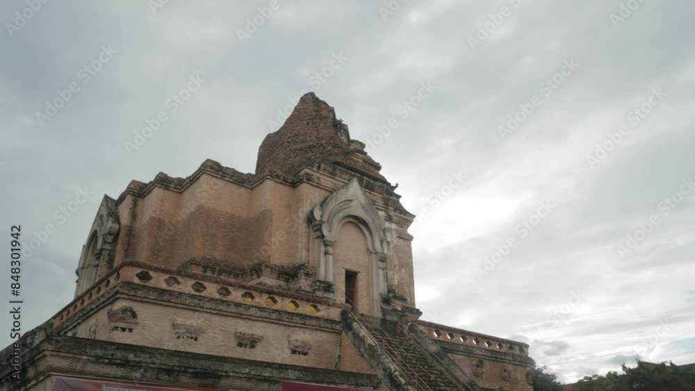 view to ancient ruin pagoda building of Chedi Luang temple in city center of Chiangmai in Thailand under cloudy day time,ancient building pagoda view to ancient ruin pagoda building of Chedi Luang temple in city center of Chiangmai in Thailand under cloudy day time,ancient building pagoda
