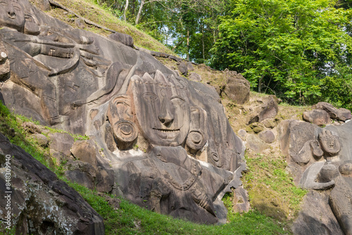 Unakoti a hindu archaeological site of bas relief structures from the ninth century. A must visit tourist destination in Tripura state of India. photo