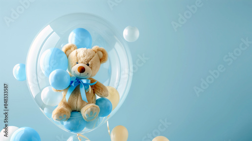 A teddy bear with a bow tie inside a clear balloon surrounded by blue balloons on light blue background, perfect for a surprise gift
