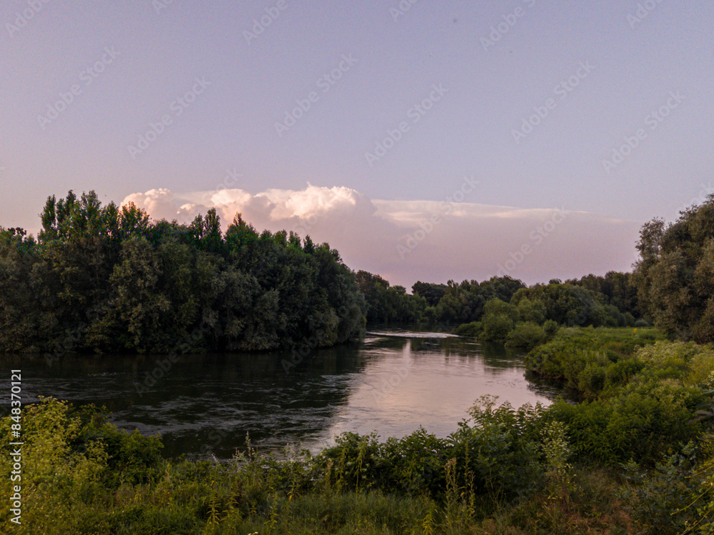 Fototapeta premium Landscape with river, trees and blue sky