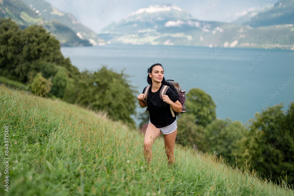 Travel woman alps mountains. Alps summer. Woman with backpack hiking. Lifestyle adventure concept forest and lake into the wild. Freedom traveler woman with backpack enjoying a nature. Travel woman alps mountains. Alps summer. Woman with backpack hiking. Lifestyle adventure concept forest and lake into the wild. Freedom traveler woman with backpack enjoying a nature.