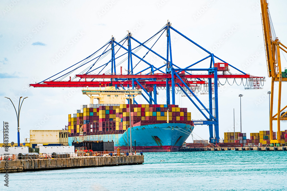 Fototapeta premium Port in Malaga, container terminal. Container cargo freight ship in port. Spain